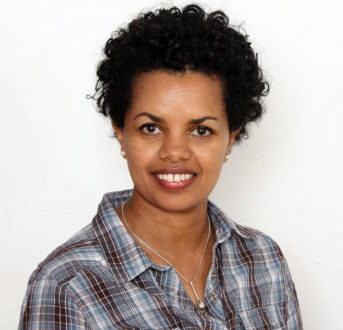 Climate change perception and system of rice intensification (SRI) impact on dispersion and downside risk: a moment approximation approach