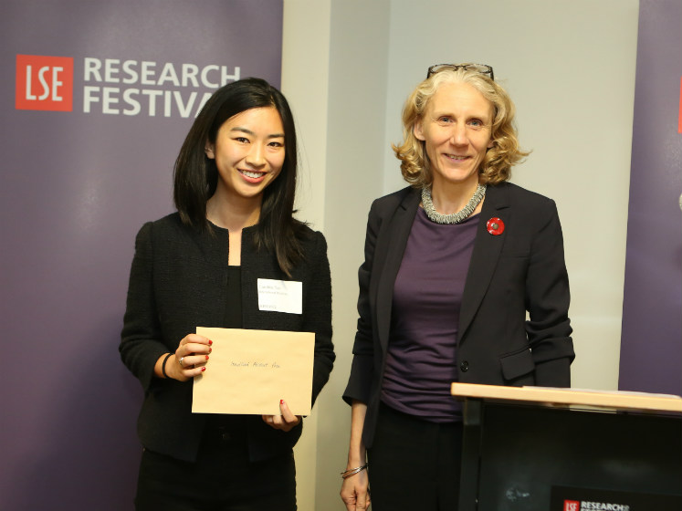 Julia Black and a winning student on the prize podium | LSE festival research competition
