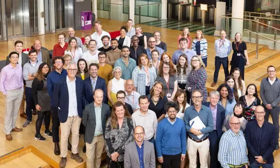 Gathering of LSE Law School  staff smiling at camera