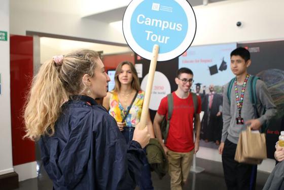 Campus tour guide during a campus tour for prospective students.
