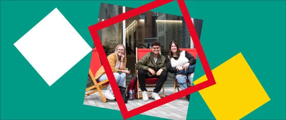 Happy LSE students sitting on LSE deckchairs on campus