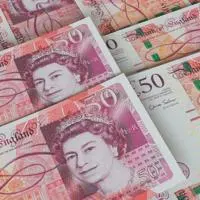 A pile of fifty pound notes