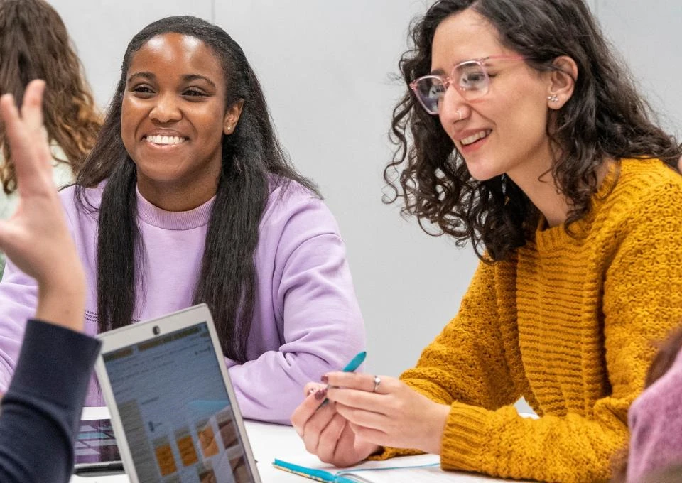 a group of students laugh together