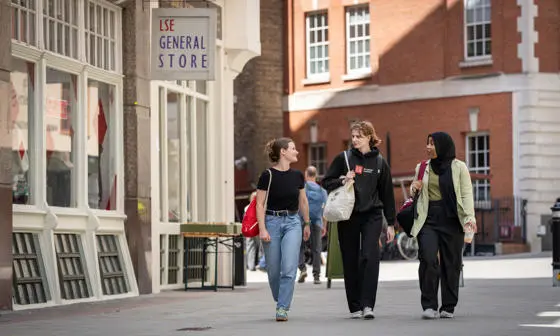 Three students walking on LSE campus