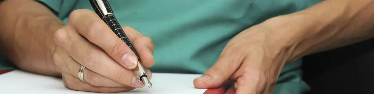 A doctor writing notes.