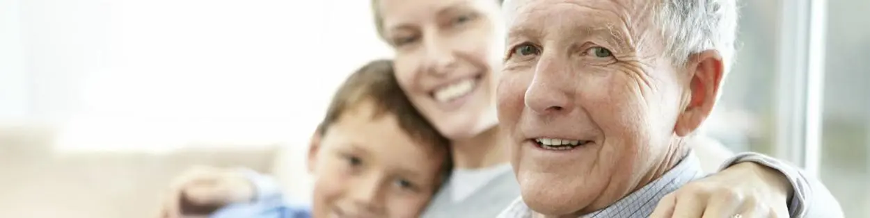 an elderly man with his daughter and grandson