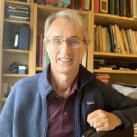 Profile image of Mike Ferguson in front of a bookcase