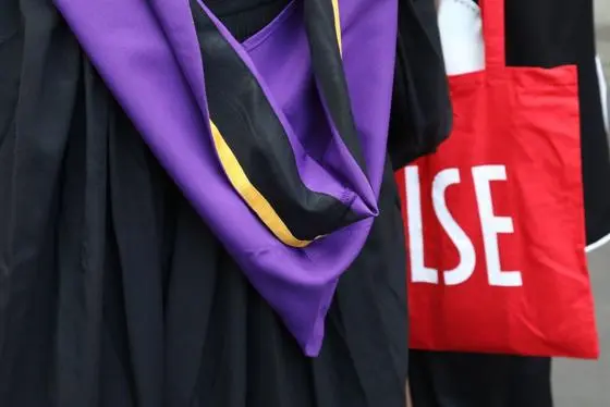 LSe graduation gown and tote bag