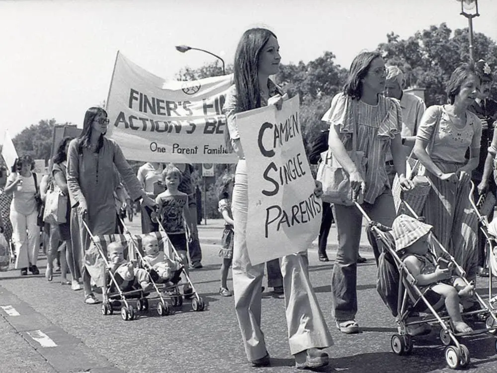 Single parents' marching along a street
