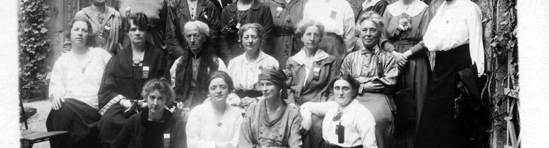 A group photo of about 20 women who were British delegates to a conference.