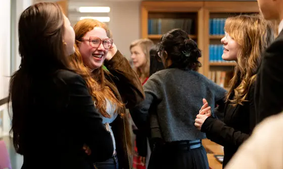 group of students smiling in discussion