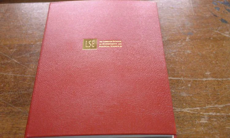 Red book cover with LSE in gold