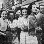 A group of expectant and smiling people.