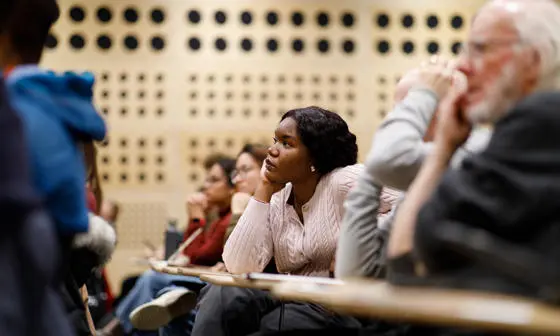 An LSE event in the Auditorium with audience members listening attentively.