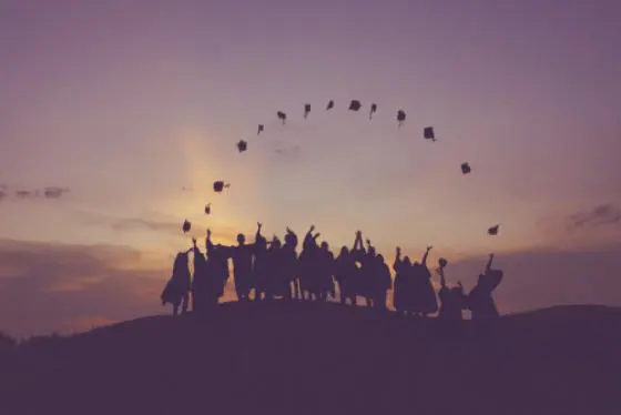 Students throwing their graduation caps