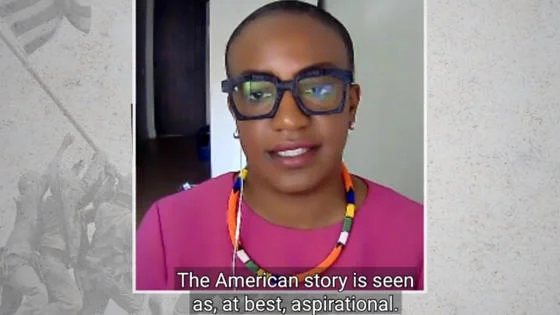 A video screenshot featuring a woman speaking
