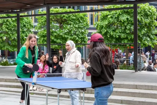Students playing ping pong