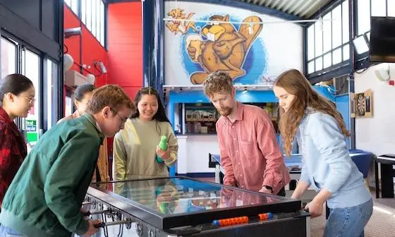 Students playing games in a halls common room