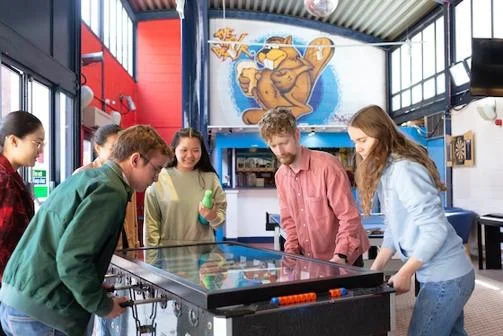 Students playing games in a halls common room
