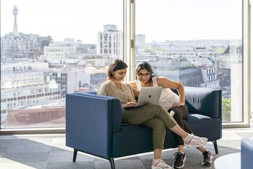 Students looking at a laptop