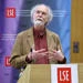 Barry Buzan speaking from LSE lectern with LSE banner in background