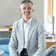 Headhshot of Kieron Boyle in a blazer and shirt