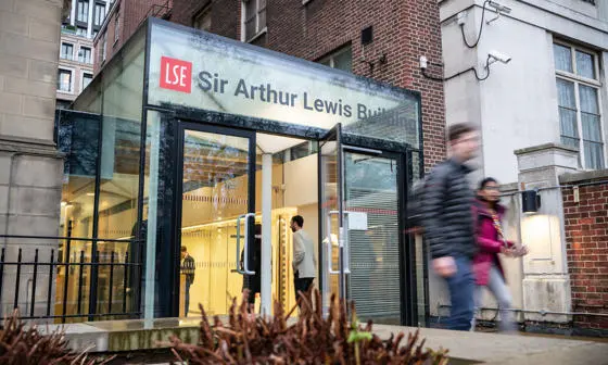 People walking in and out of the entrance to Sir Arthur Lewis Building
