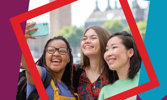 students smiling taking selfie