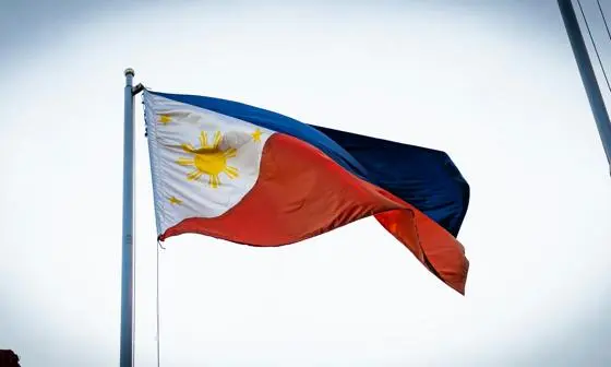A Filipino flag flying on a mast