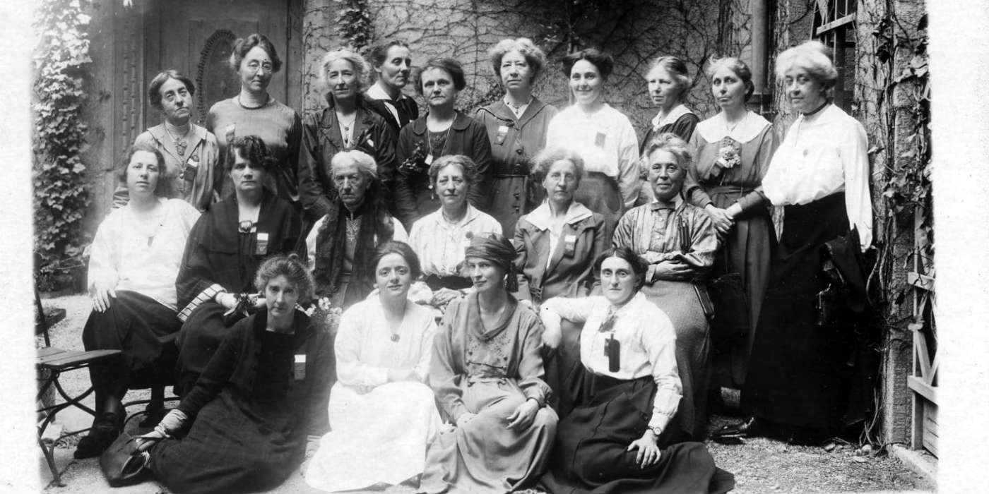 A group photo of about 20 women who were British delegates to a conference.