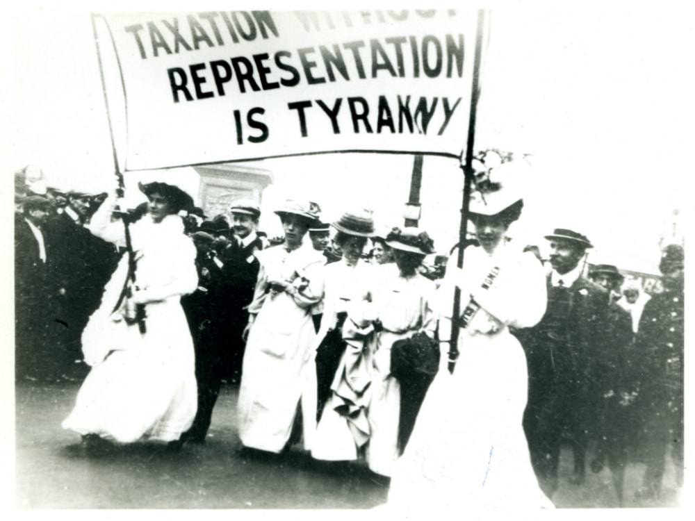 A suffrage parade in the 1900s