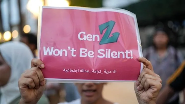 moroccan protestor holding a protest sign
