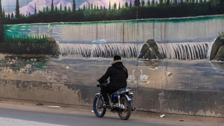 A motorcyclist in Qamishlo, Syrian Kurdistan