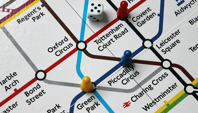 Picture of tube map from The London Game, with a die and game pieces