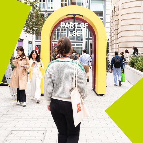 Student walking through an arch