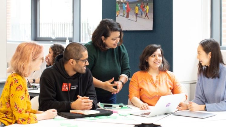 A group of students sitting at a table