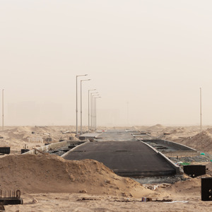 Photo of Abu Dhabi construction, road meeting desert