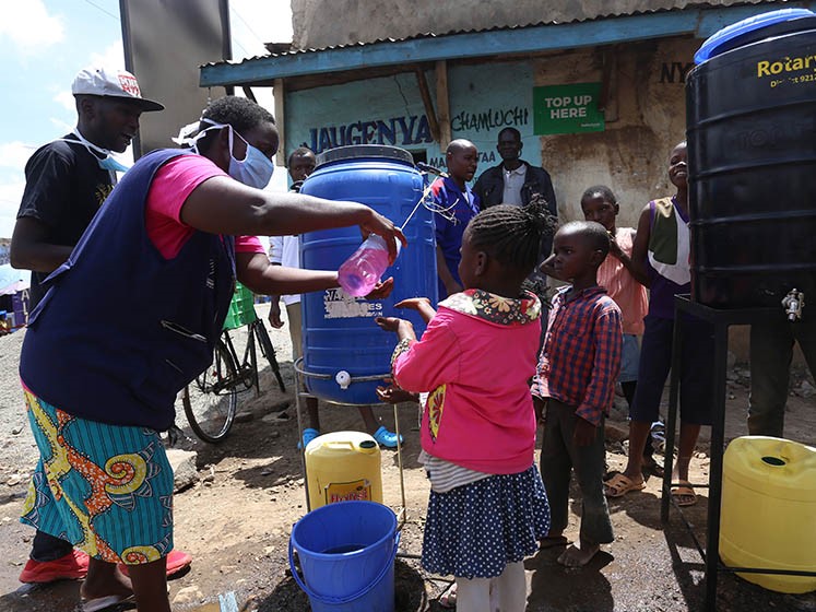 child washing hands 747x560