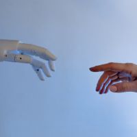 Human_robot_hands_interacting_Stock_image_from_Canva_200x200