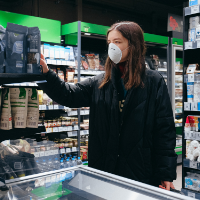 Woman in mask in supermarket 200x200_stock