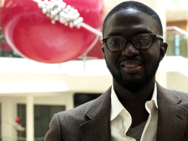 Atta Addo standing in a large foyer of a building | LSE researcher profiles