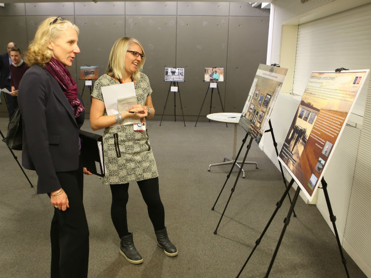 A selection of posters lined up in a row at an exhibition | LSE festival research competition