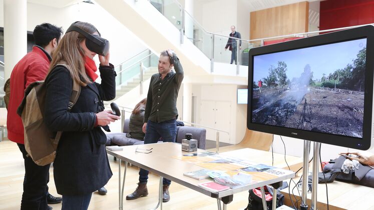 Two visitors try out the VR at Dr Thomas Smith's Research Showcase stand at the LSE Festival, March 2020. LSE/Maria Moore.