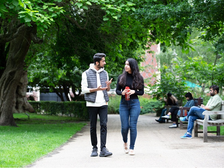 Students walking in Lincolns Inn Fields