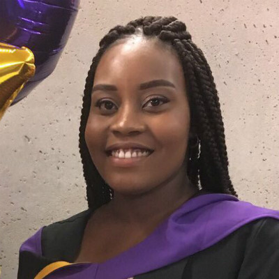 A headshot of Chrisann Jarrett in graduation uniform.