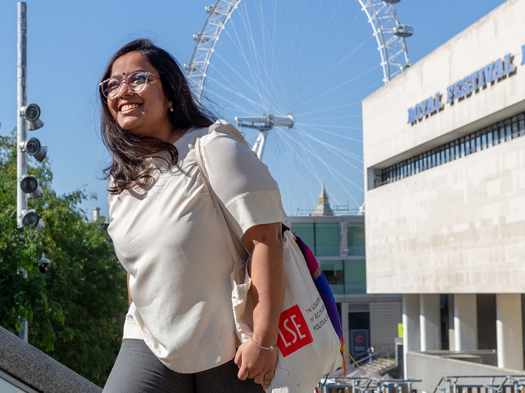 LSE student at the Royal Festival Hall near the London Eye