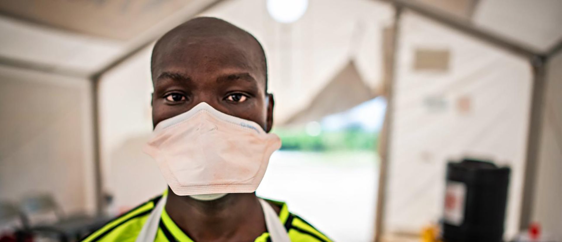 Banner Uganda-Red-Cross-volunteer-helping-screen-thousands-of-people-who-cross-the-border-each-day-from-the-Credit-IFRC