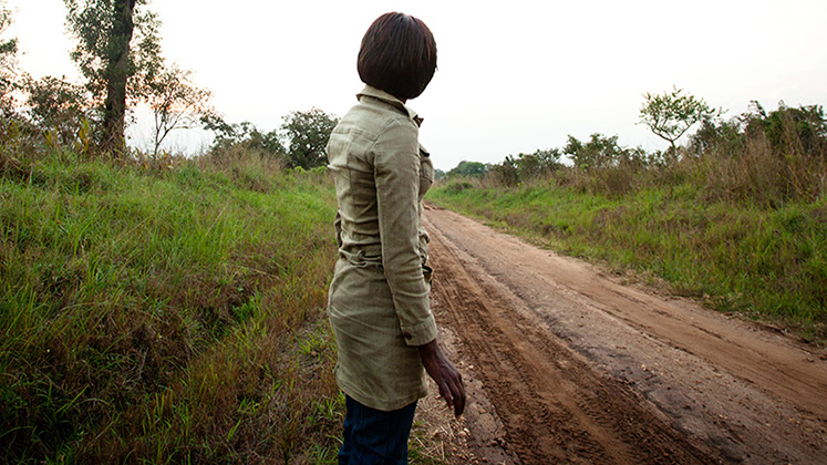 A woman, formerly part of the LRA, looks for transport to return to the city