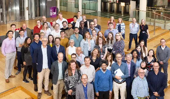Gathering of LSE Law School staff smiling at camera