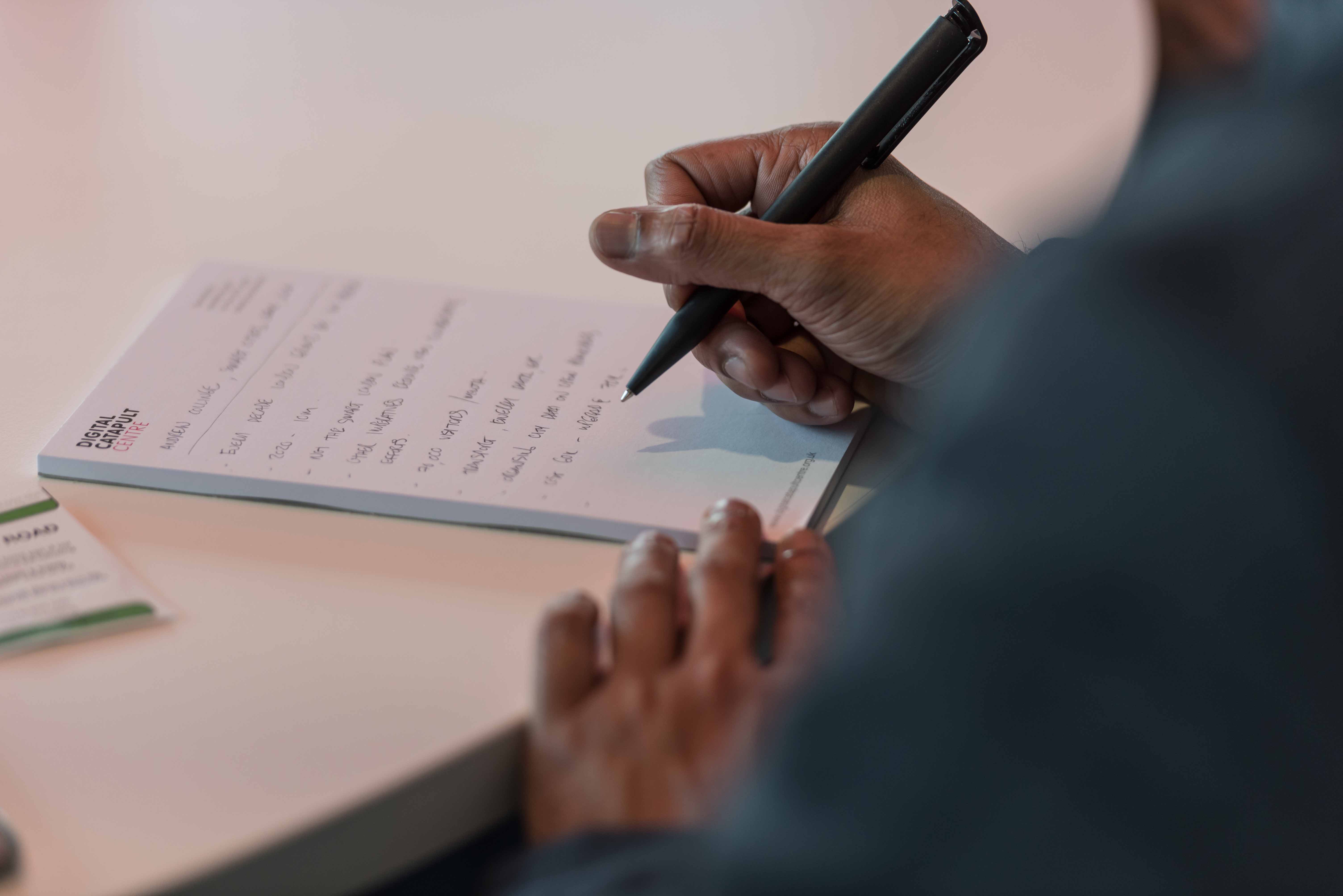 Close up of person handwriting notes